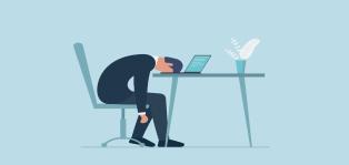 Man Sleeping At Desk
